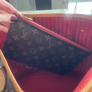 Luis Vuitton never full tote with wristlet. Very good condition.